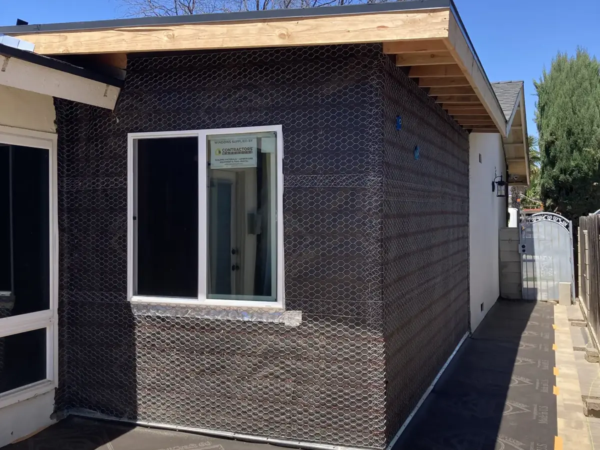 Compact detached ADU in a backyard